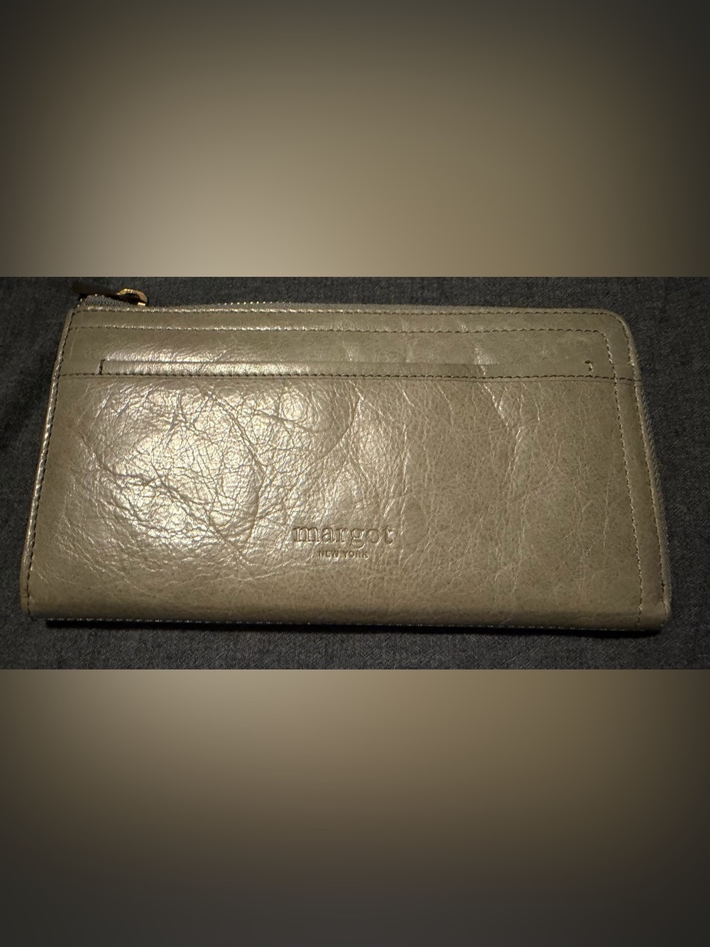 Margot “Gabby” zip around wallet in grey/beige with light blue accents.